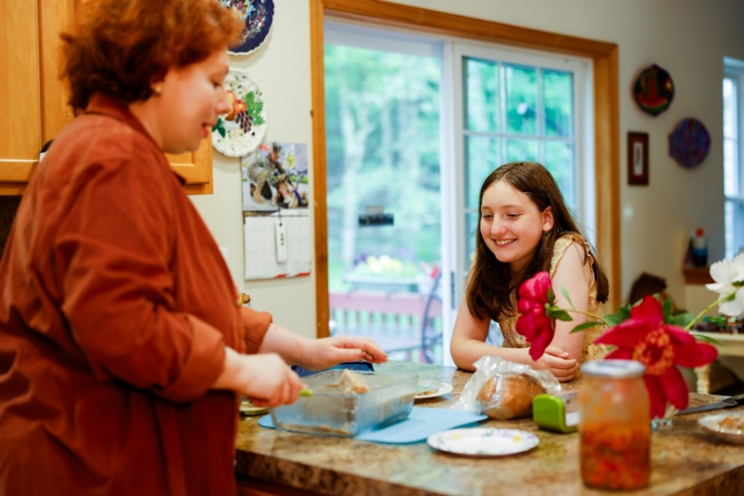family at kitchen table discussing finances